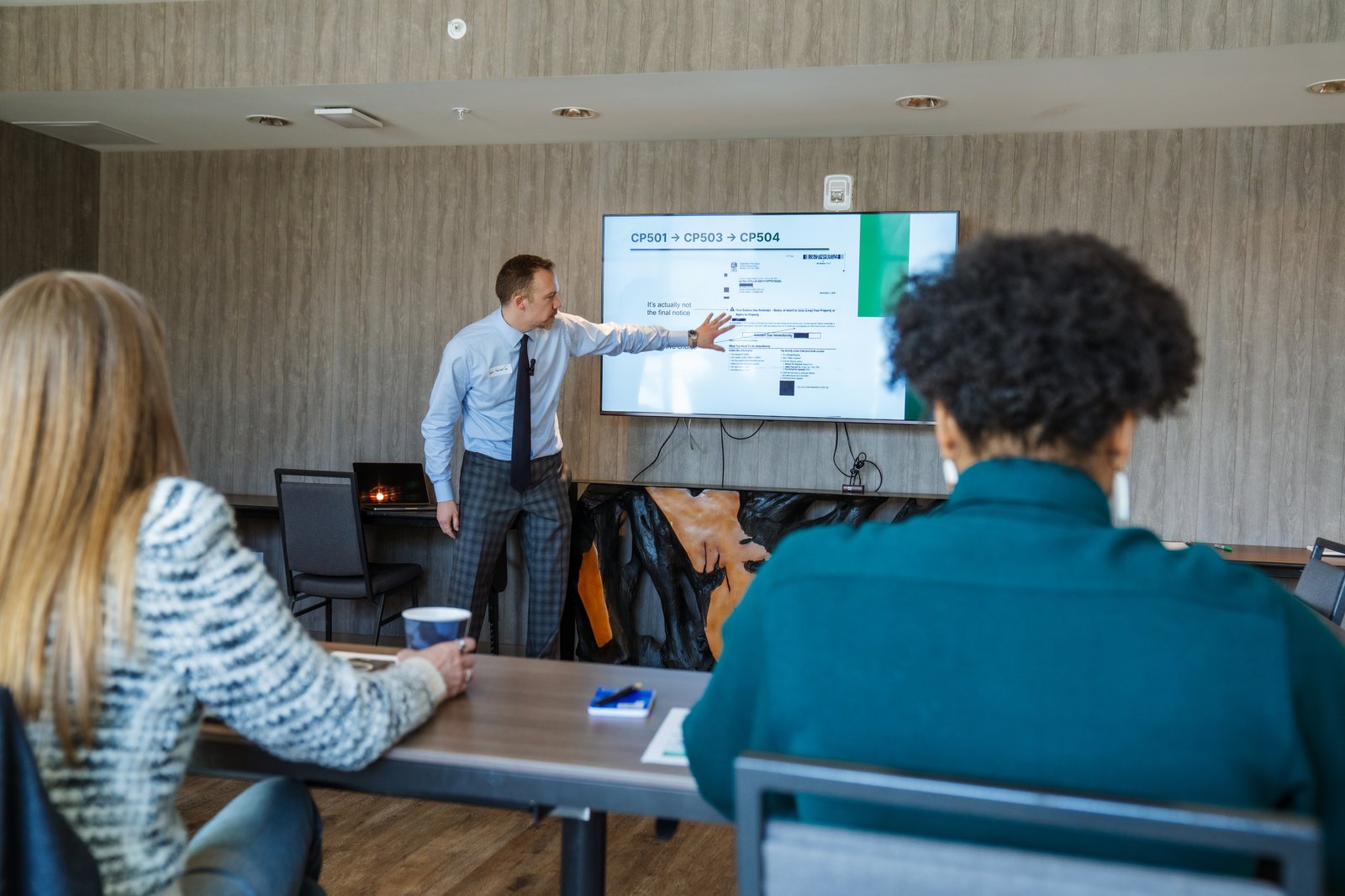 Joshua Taylor presenting at a Summit County Chamber of Commerce educational seminar on IRS notices
